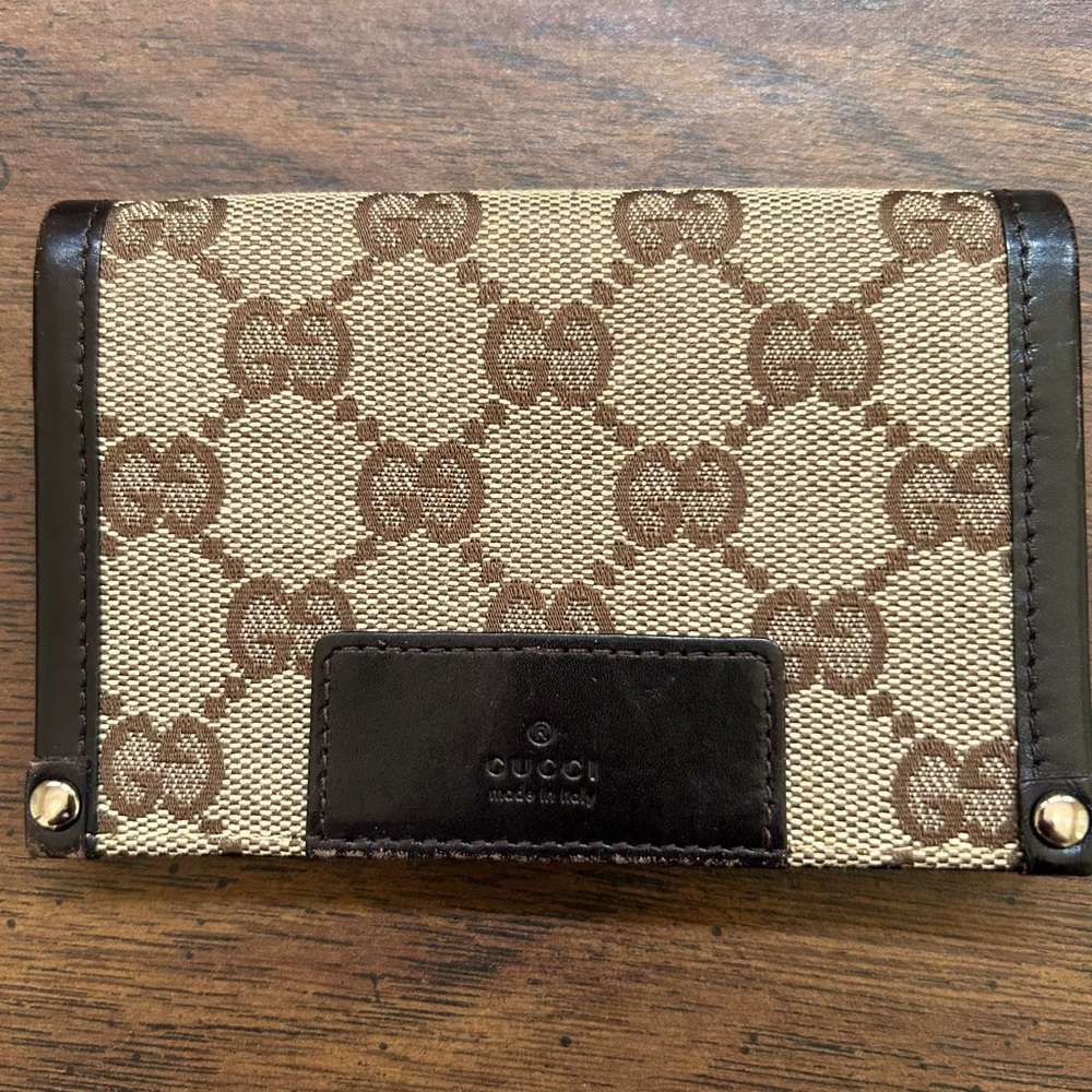 Small wallet combines the House's Monogram canvas with chocolate leather trim.